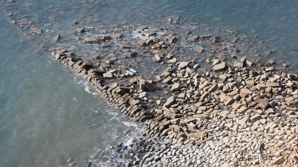 Toppled Gormley statue