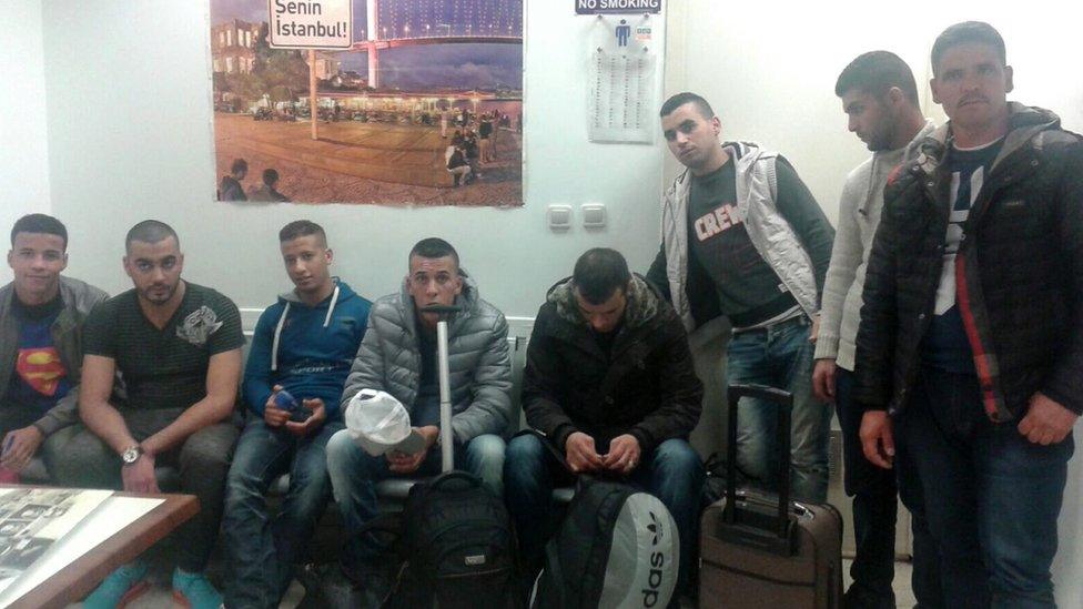 A handout picture provided by Istanbul Police Department taken with a smartphone shows, eight Moroccans men who are alleged supporters of the Islamic State