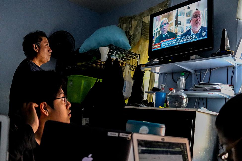 Ana's father watches news with her brother