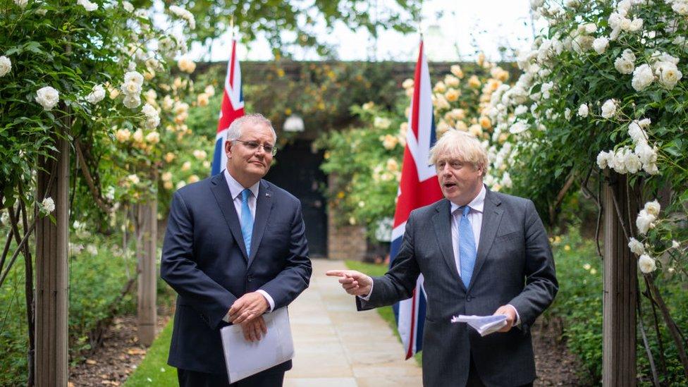 UK Prime Minister Boris Johnson (R) and Australian Prime Minister Scott Morrison in the garden of 10 Downing Street on 15 June 2021 in London, England