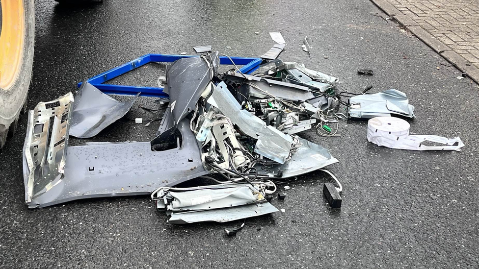 Remains of a cash machine on a road after a ram-raid at the Nationwide branch in Newmarket