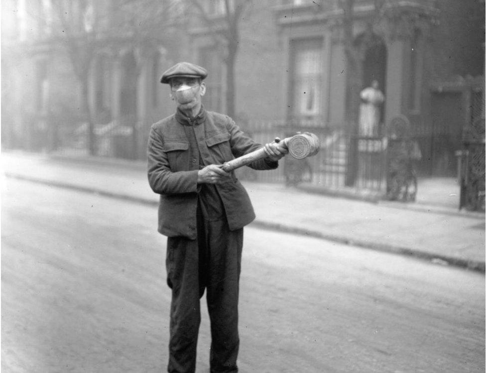 man wielding a spray