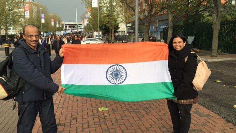 Couple holding flag