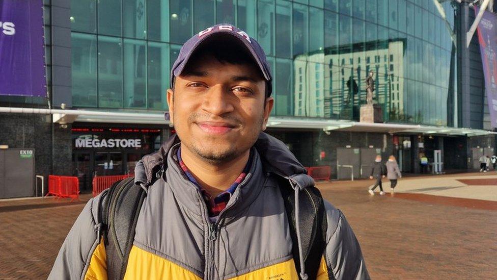 Fan outside Old Trafford Stadium