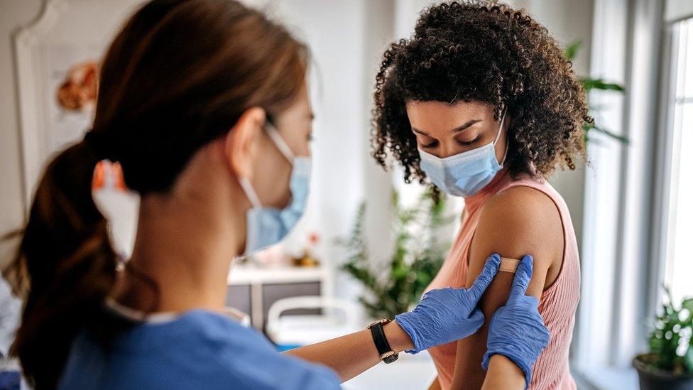 Woman being vaccinated