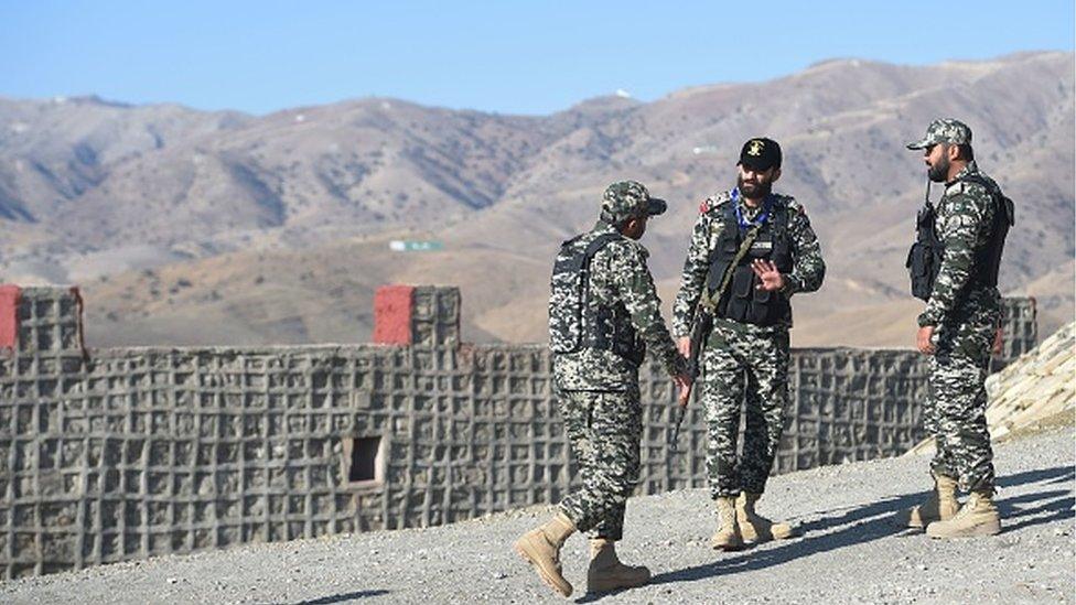 Pakistani soldiers stand guard