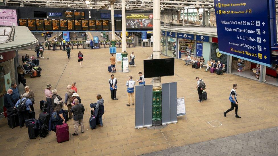 Passengers at Edinburgh's Waverley Station, as train services continue to be disrupted