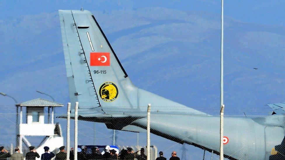 Turkish honour guard carries coffin of Russian pilot into a Turkish Air force transport plane at Hatay airport, 29 Nov 2015.