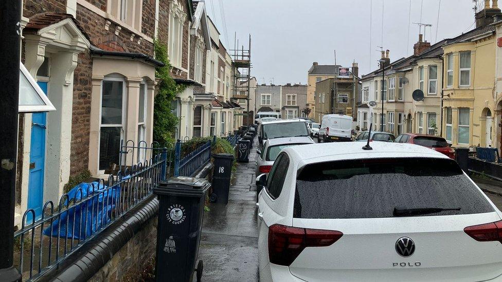 A road in Easton with lots of cars parked on the pavement