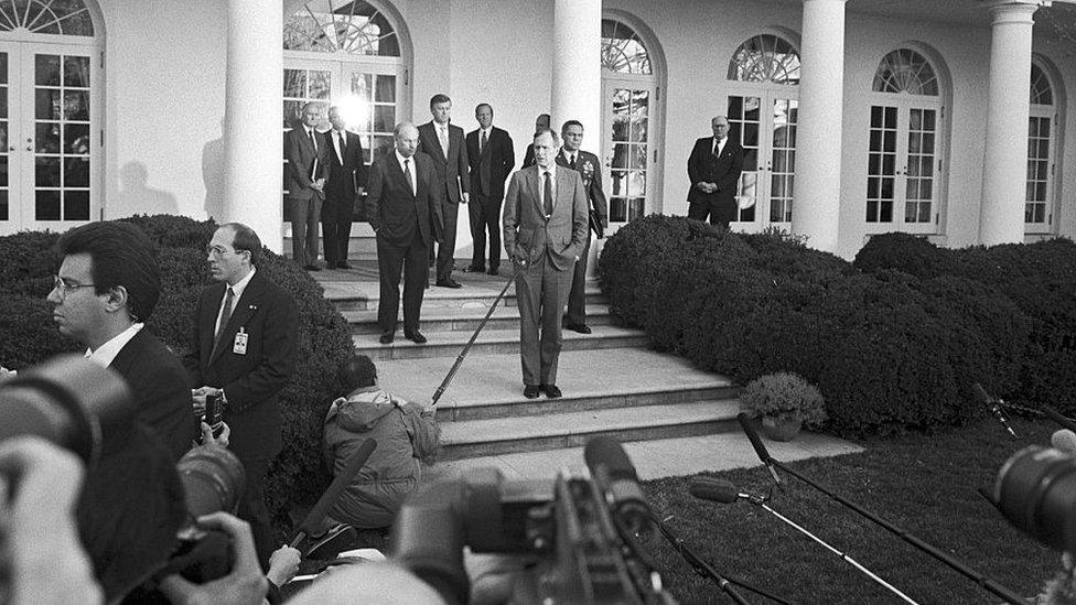 George HW Bush at the White House in 1991, with Dick Cheney and Colin Powell, prior to commencement of Desert Storm