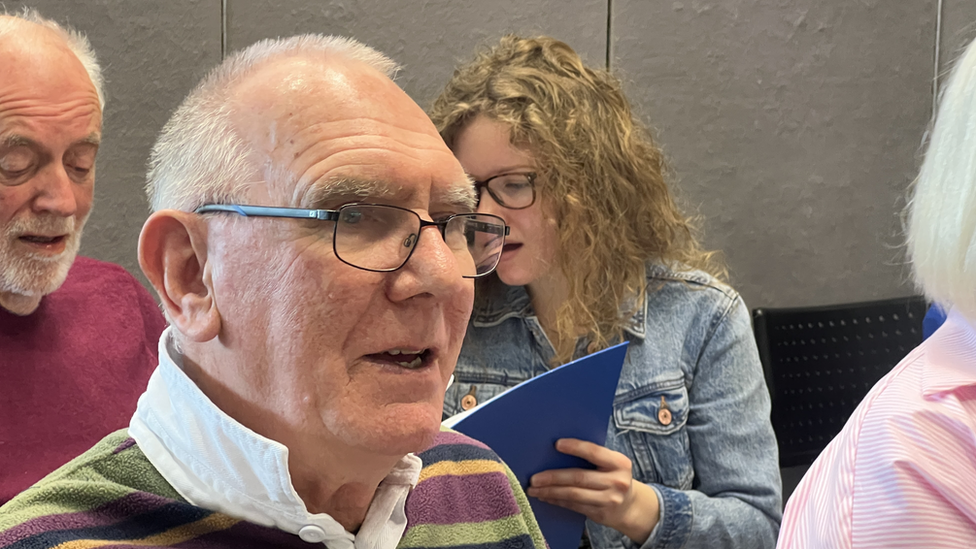 Roger Woodrow singing in the choir