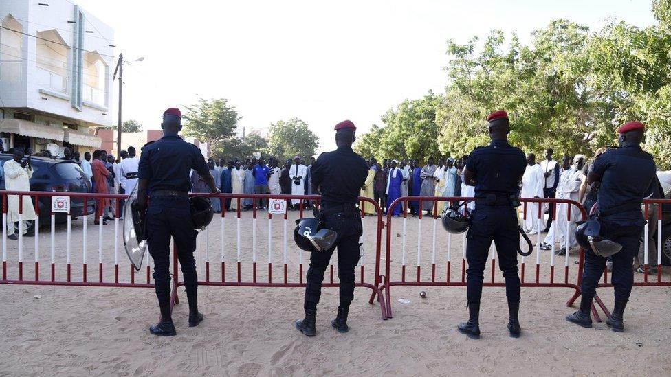 Police officers stand in front of the court where the verdict was handed down