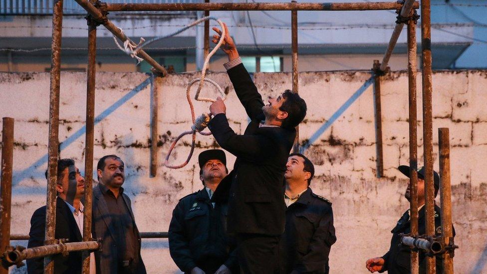 Iranian officials prepare a noose for an execution in Noor of a convicted murderer who was eventually spared by the mother of his victim (15 April 2014)