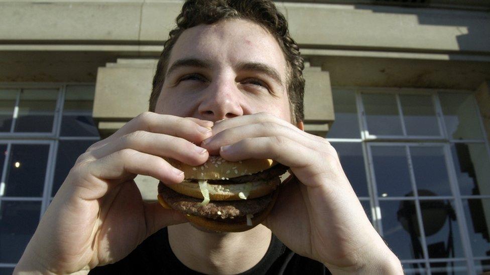 a man eats a burger