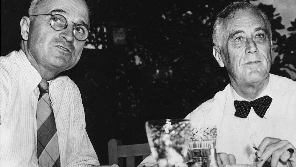 Franklin Delano Roosevelt (1882 - 1945) with his vice-president and successor Harry S Truman (1884 - 1972) on the lawn of the White House