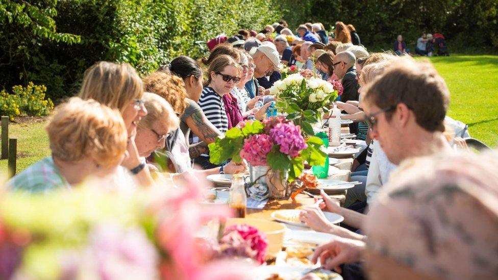 People enjoying a community meal