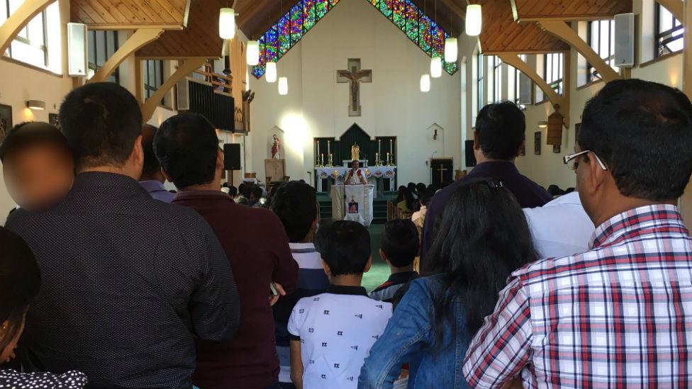 People at church service for Cyriac Joseph