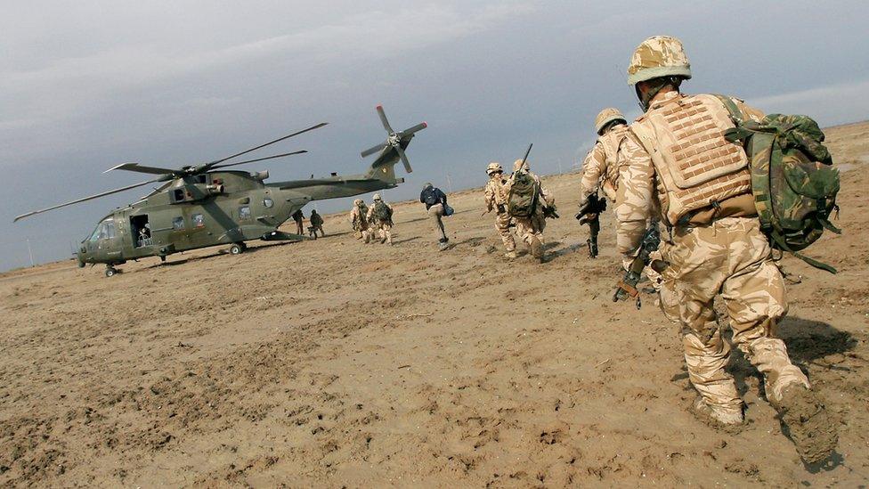 UK troops and a military helicopter