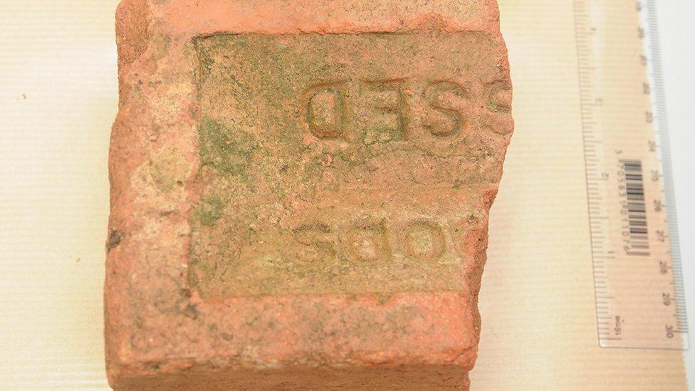 Half of a red house brick