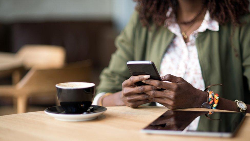 Woman with phone and tablet