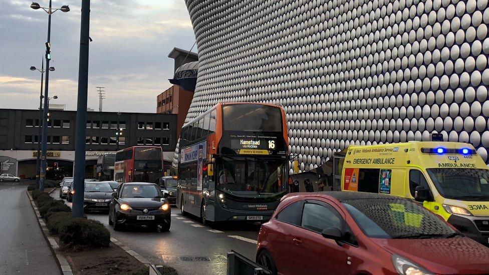 An ambulance and a bus in Birmingham city centre