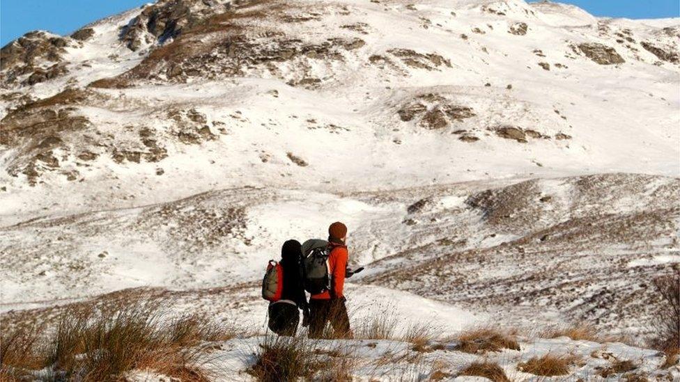 Hill walkers up the mountain Ben Lawers in Perthshire