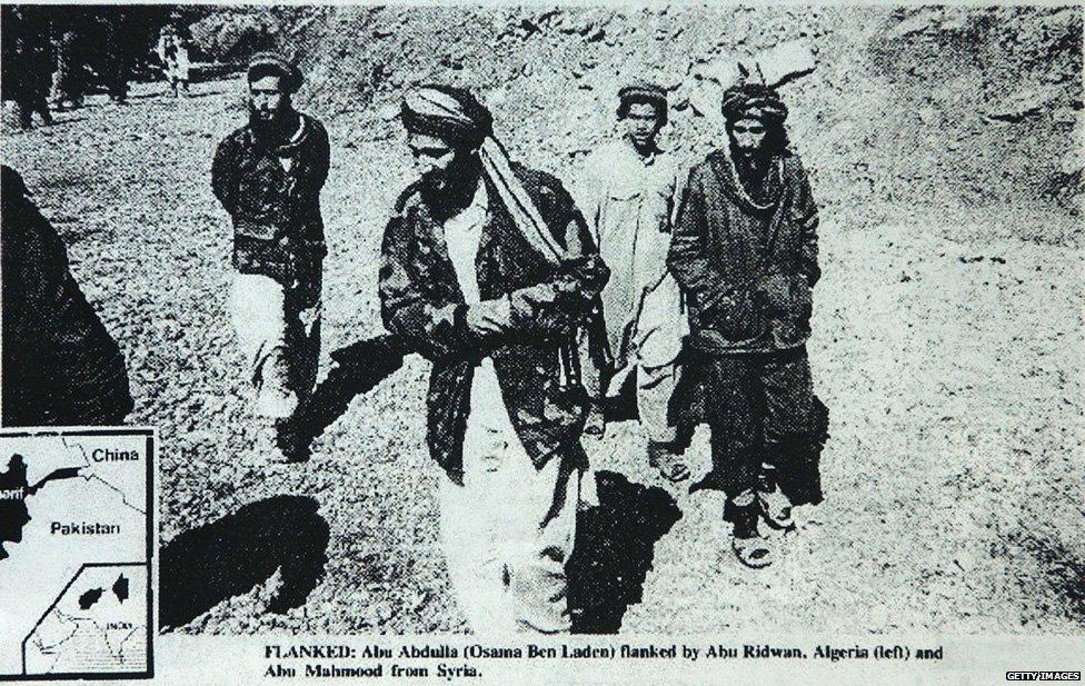 Federal prosecutors in Chicago say that this photo, published May 4, 1988, in the English-language newspaper 'Arab News,' shows Enaam Arnaout (R), head of the Palos Hills, Illinois branch of the Islamic charity Benevolence International Foundation, walking with Osama bin Laden