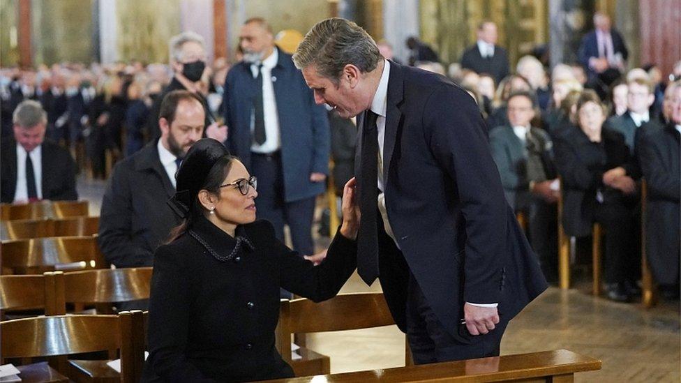 Sir Keir Starmer speaks with Home Secretary Priti Patel ahead of a requiem Mass for Sir David Amess