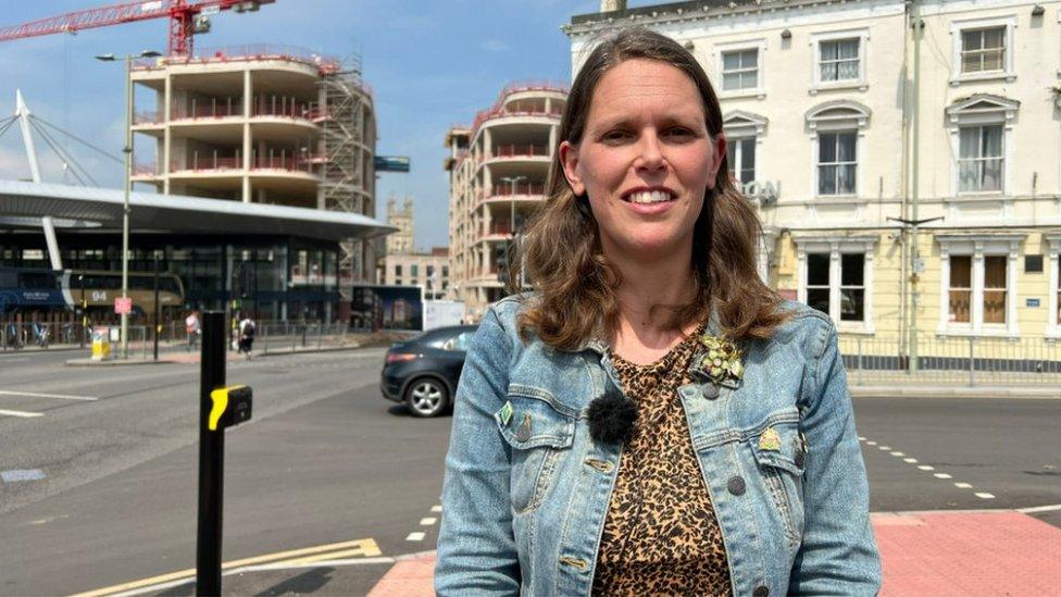 Emily Gibbon, manager Gloucester Bid, standing in front of building work on The Forum