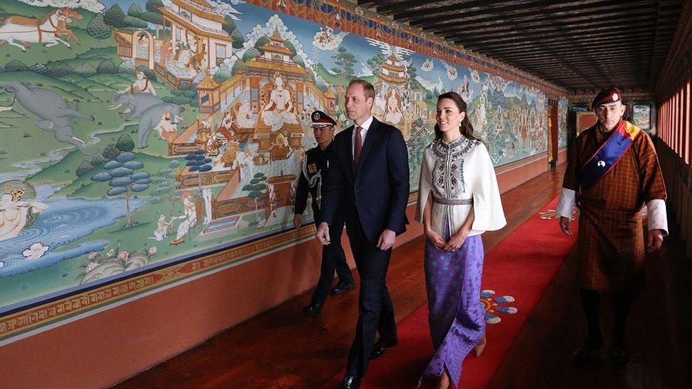 Duke and Duchess of Cambridge walk through Lingkana Palace after meeting the king and queen of Bhutan