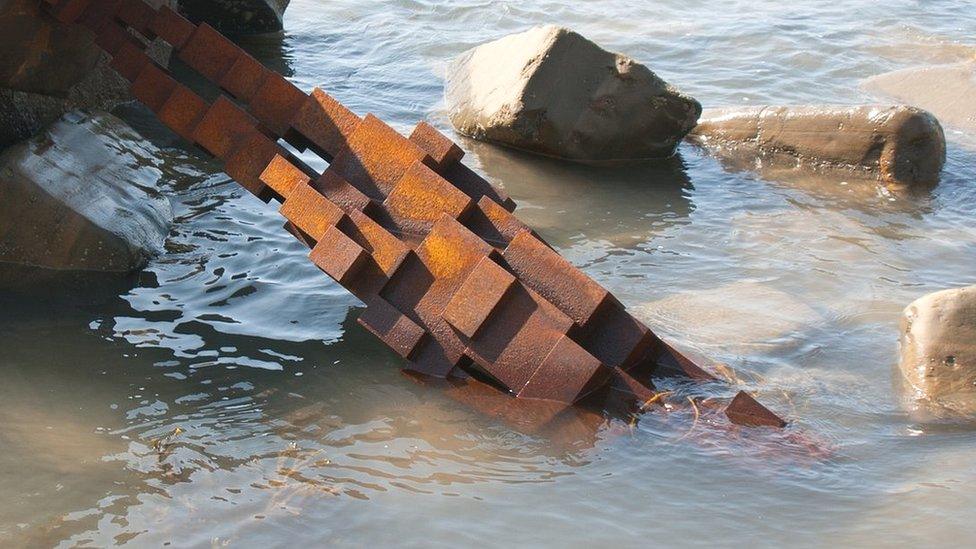 Toppled Gormley statue