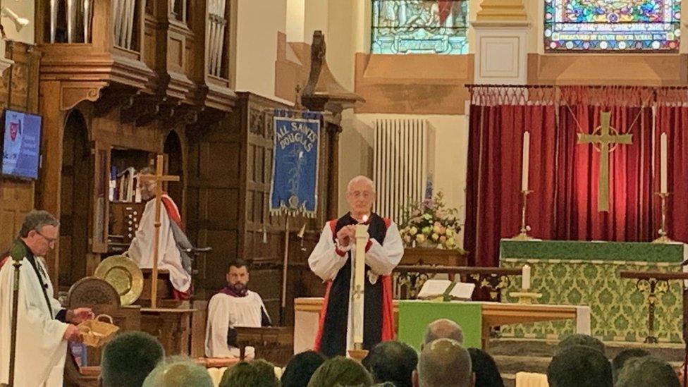 Bishop of Sodor and Man lighting a candle