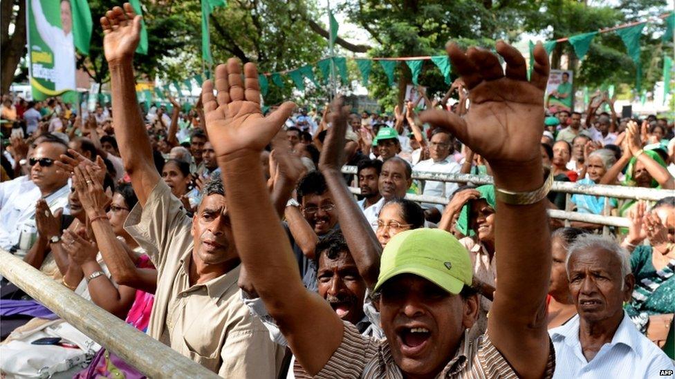 Supporters cheer for Sri Lanka"s Prime Minister Ranil Wickremesinghe during an election rally in the central town of Kandy on July 14, 2015.