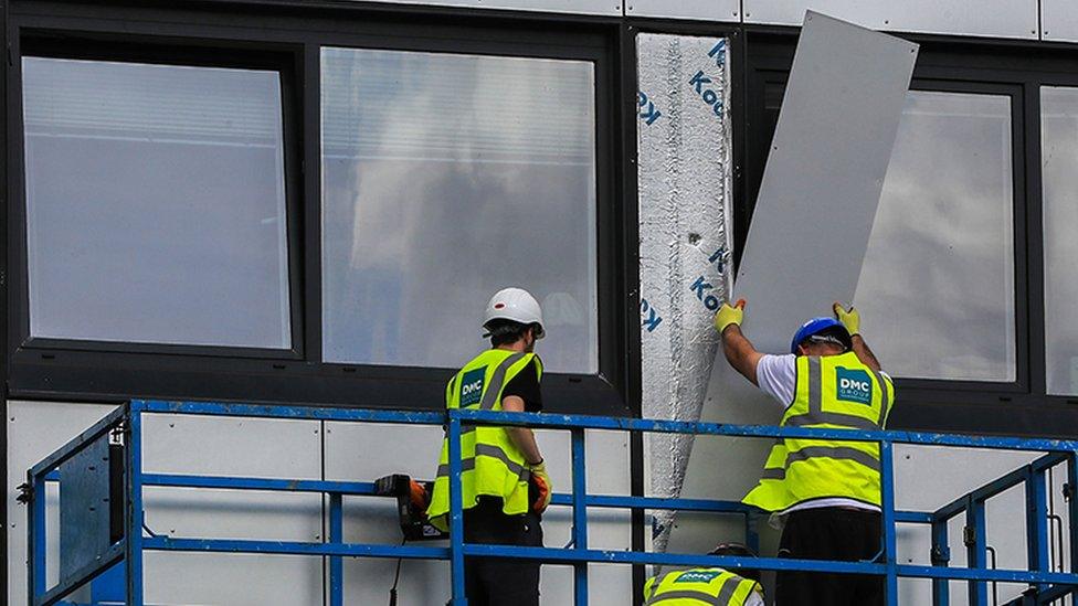 cladding being removed from Whitebeam Court, in Pendleton, Greater Manchester, 2017