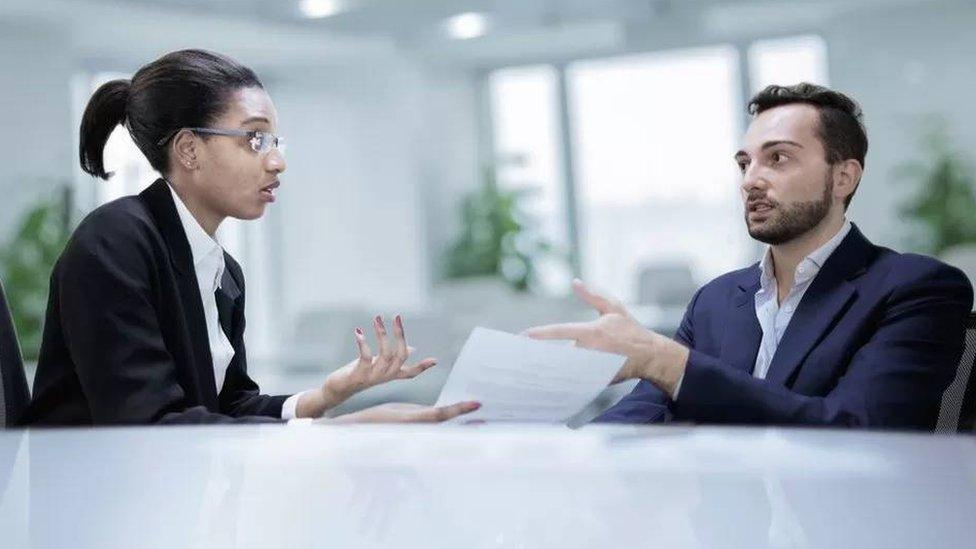 Woman and man in an office