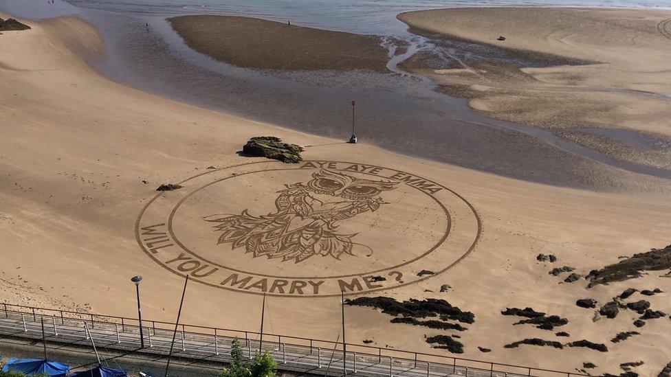 A sand engraving proposal on Tenby beach