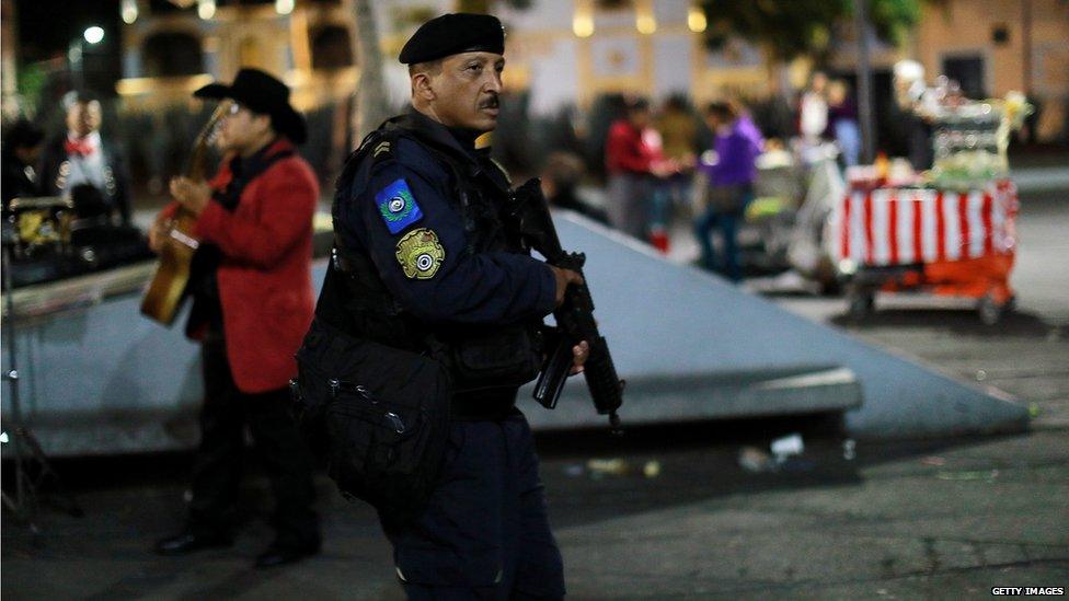 Police patrol the area of Mexico City where gunmen dressed as mariachi musicians killed three people (15 Sept)