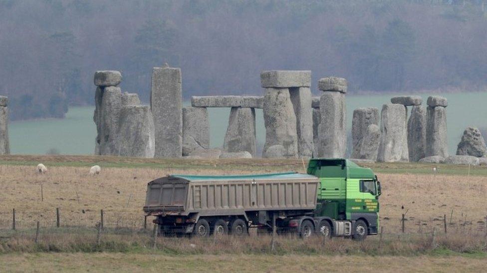 Traffic passes Stonehenge