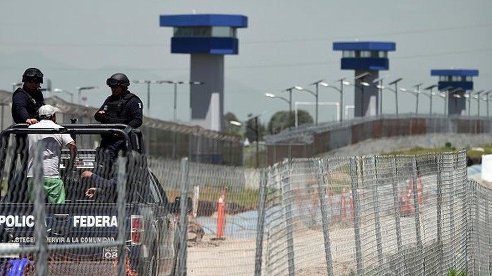 Federal Police officers patrol the perimeter of the Altiplano prison in Almoloya de Juarez, Mexico, on 13 July, 2015.