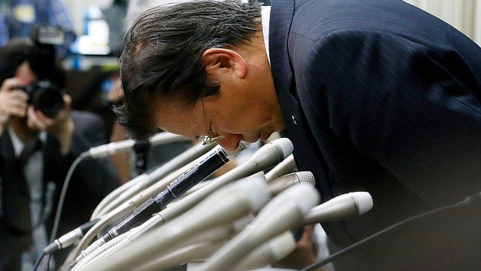 President Aikawa bows in apology