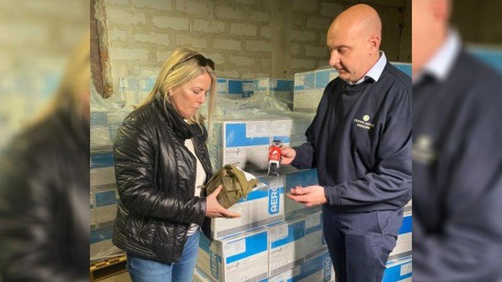 People inspecting medical trauma kits in Poland