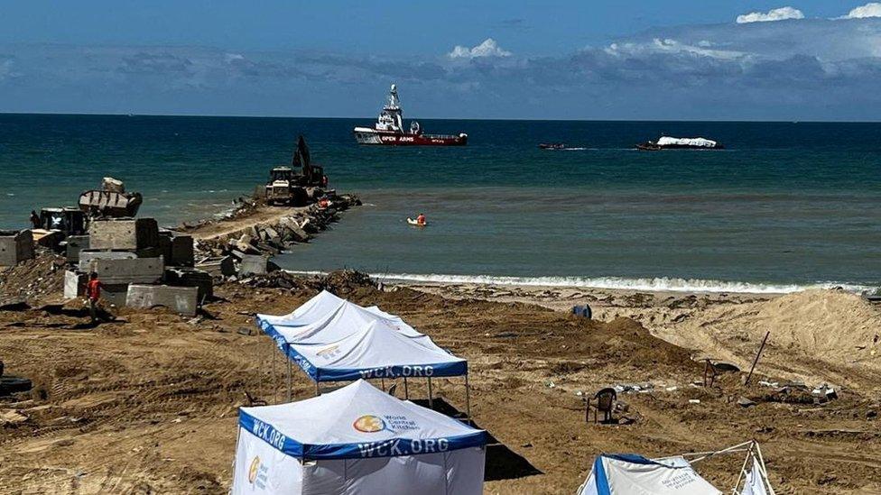 Open Arms rescue vessel tows a World Central Kitchen (WCK) barge loaded with food towards Gaza, where there is risk of famine after five months of Israel's military campaign, in this handout image released March 15, 2024