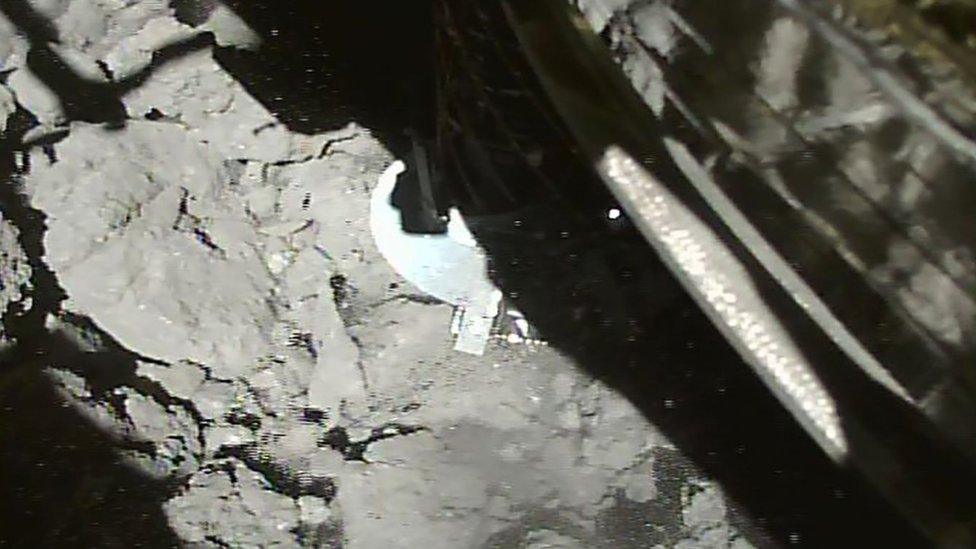 Spacecraft landing on rock surface