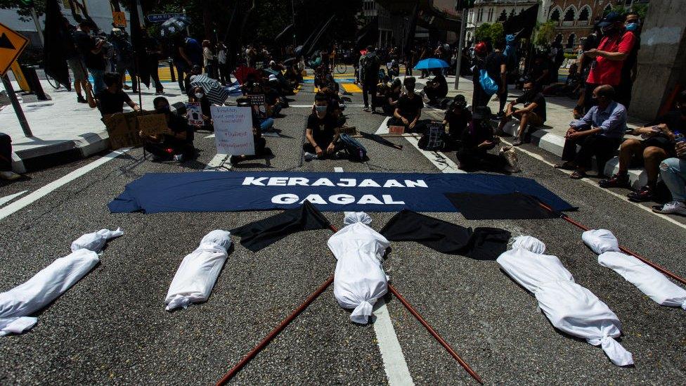 Citizens in Malaysia protested in front of fake corpses to symbolise high number of deaths