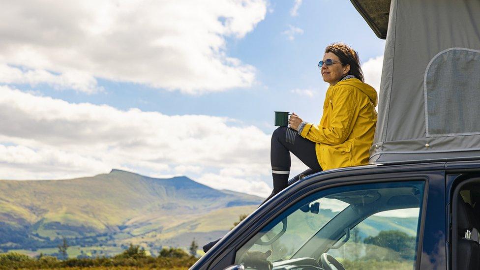 Camper enjoys the view over Brecon Beacons