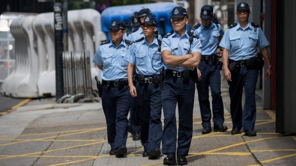 Police patrol a security area where Chinese state leader Zhang Dejiang will reside and deliver a speech during his 3-day visit in Hong Kong, China, 16 May 2016