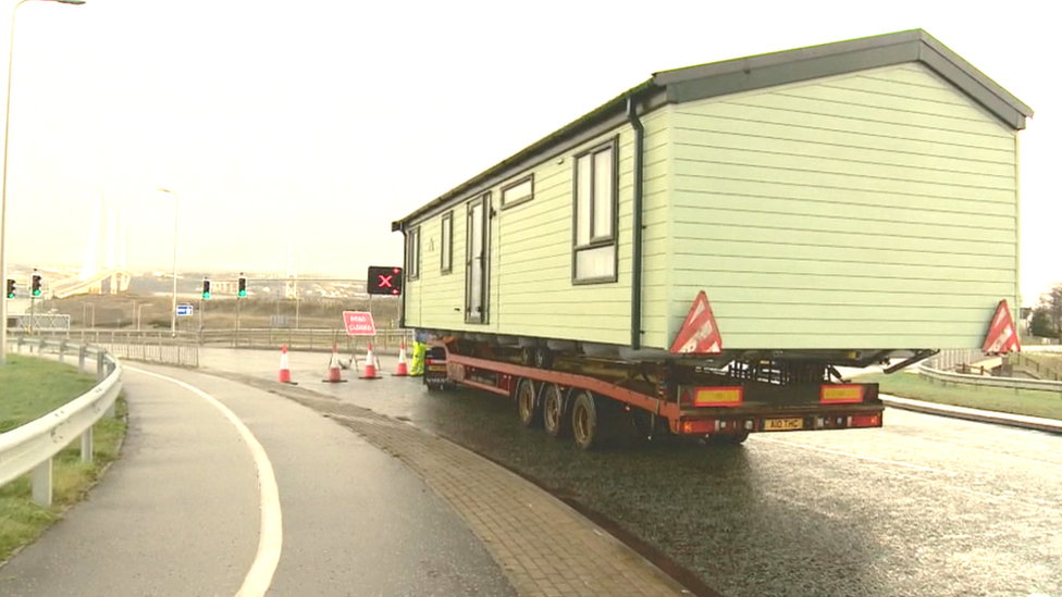 Lorry carrying house