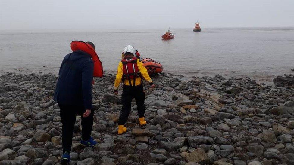 Three Russians being rescued