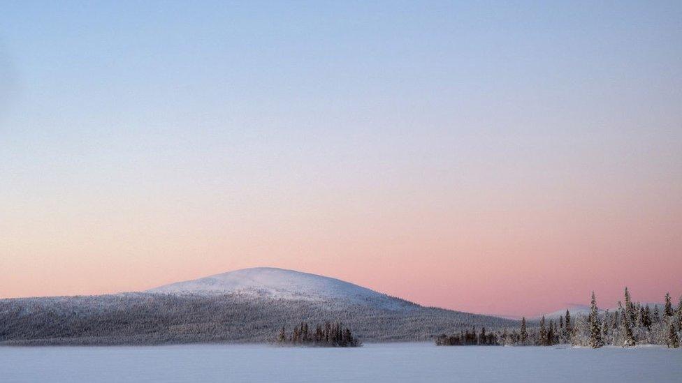 Sunrise over the frozen lake of Jeresjarvi on 20th February 2020 in Finnish Lapland