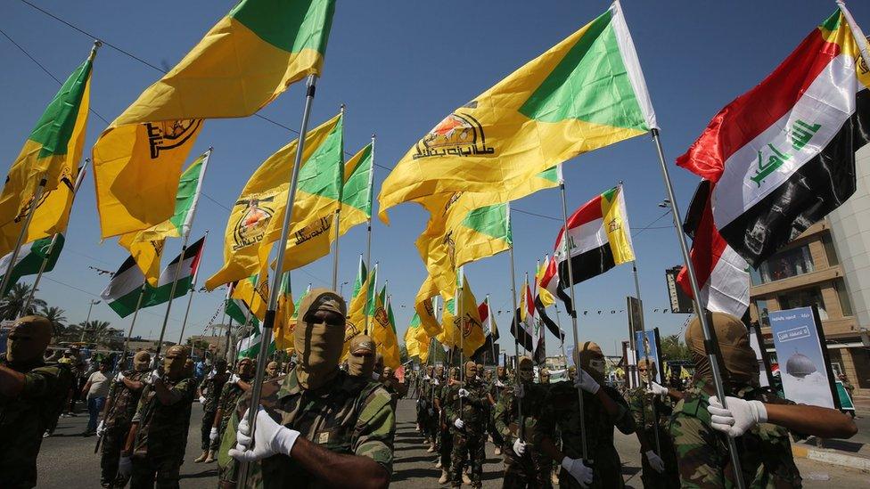 Fighters from the Iran-backed militia Kataib Hezbollah parade through Baghdad, Iraq (31 May 2019)